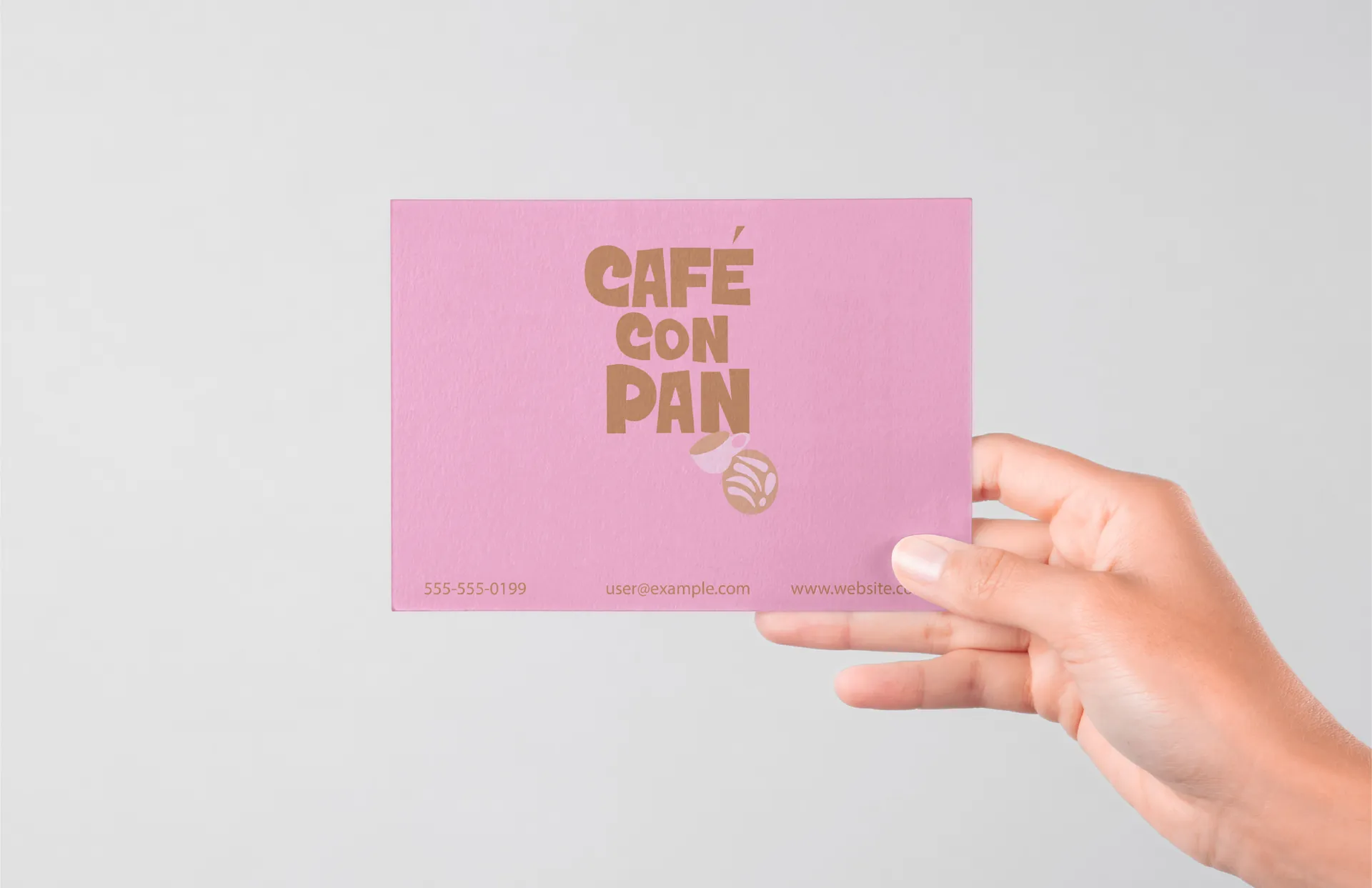 Café con Pan brand card with gold lettering on a pink background.